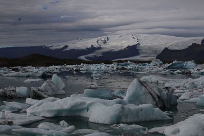 Scenic view of frozen lake against sky