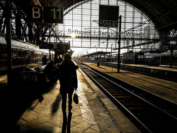 Man walking on railroad station platform