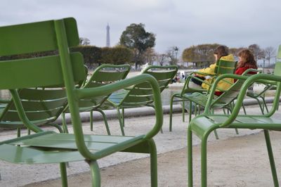 High angle view of people sitting on chair at playground