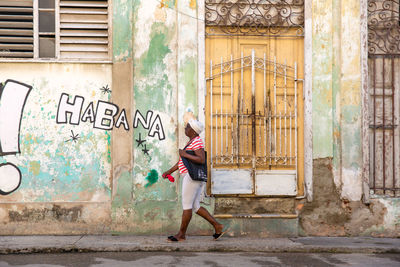 Side view of woman walking in city