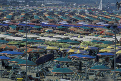 High angle view of empty chairs at beach