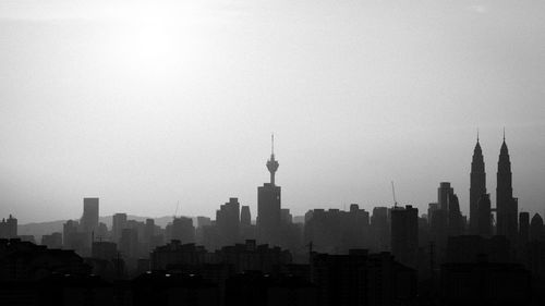 Skyscrapers in city against clear sky