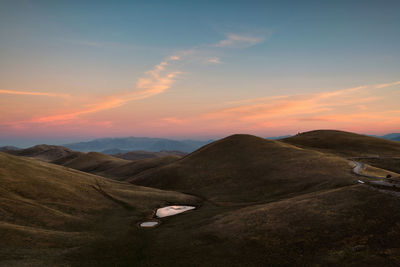 Scenic view of mountains against sky during sunset