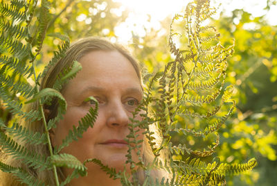 Posing by a female model in a park at the beginning of autumn