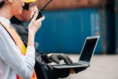 Side view of man using mobile phone