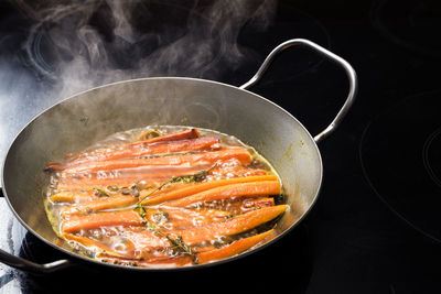 High angle view of meat in cooking pan