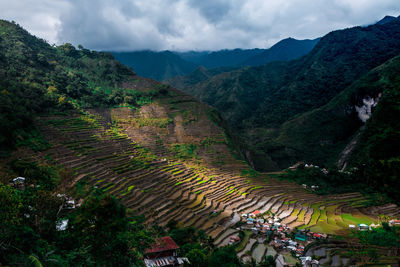 High angle view of trees and mountains against sky