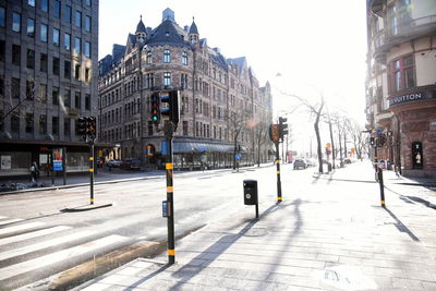 Road passing through city buildings