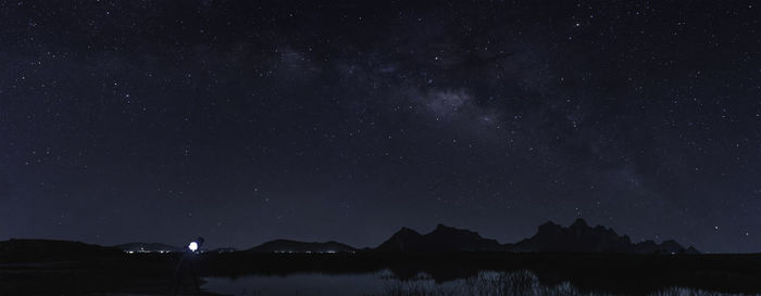 Scenic view of lake against star field at night