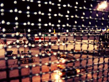 Defocused image of illuminated city at night