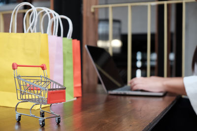 Man using laptop on table at store