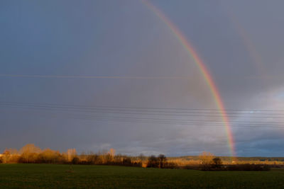 Scenic view of rainbow against sky during sunset