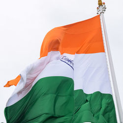 India flag flying high at connaught place with pride in blue sky, india flag fluttering, indian flag