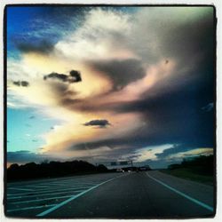 View of road against cloudy sky