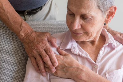 Close-up of couple holding hands