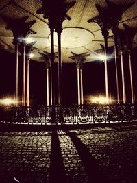 View of illuminated street lights at night