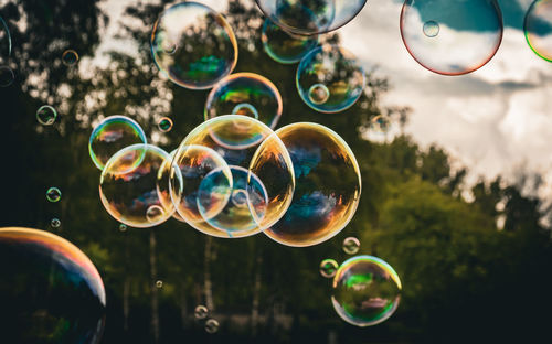 Close-up of bubbles against sky