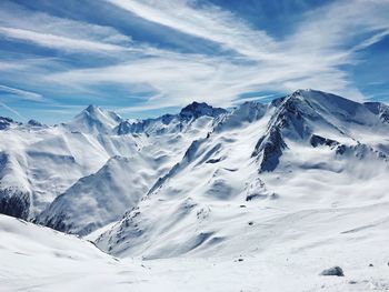 Scenic view of snowcapped mountains against sky