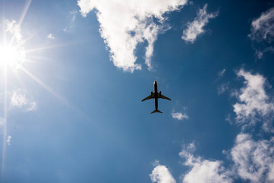 Low angle view of airplane flying in sky