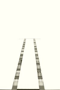 Low angle view of skyscraper against clear sky