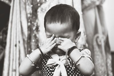 Close-up of boy holding leaf