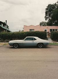 Cars on road against sky