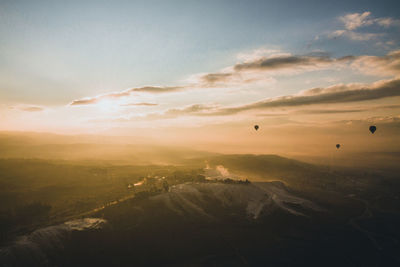 Scenic view of landscape against sky during sunset