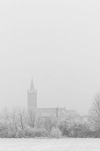 View of clock tower in foggy weather