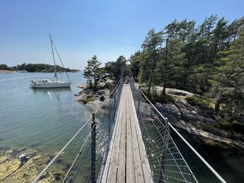 Panoramic view of bridge over sea against sky