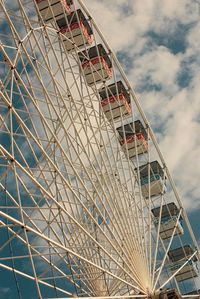 Low angle view of ferris wheel against sky