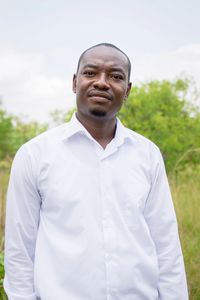 Portrait of young man standing outdoors