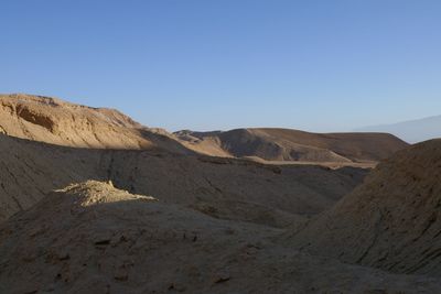 Scenic view of desert against clear sky