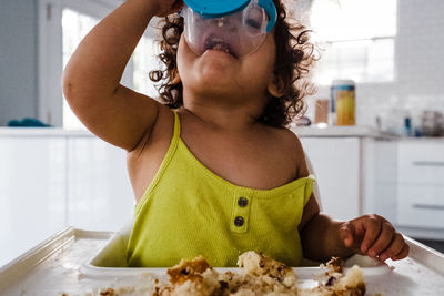 Hungry child eating snack