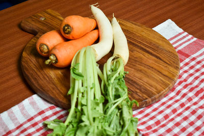 High angle view of vegetables on cutting board