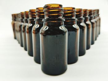 Close-up of bottles against white background