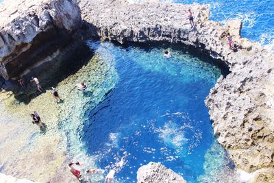 High angle view of people enjoying at beach during summer