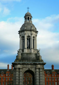 Low angle view of the campanile of trinity college dublin against sky