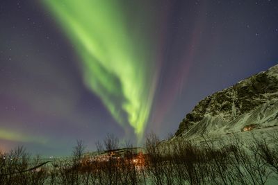 Scenic view of aurora borealis over iceland