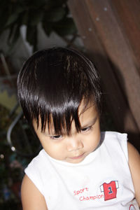 Close-up of cute boy looking away outdoors