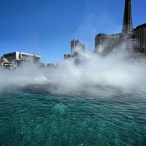 Panoramic view of sea against buildings