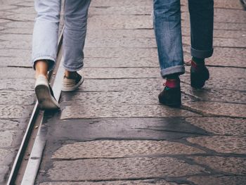 Low section of people walking on tramway