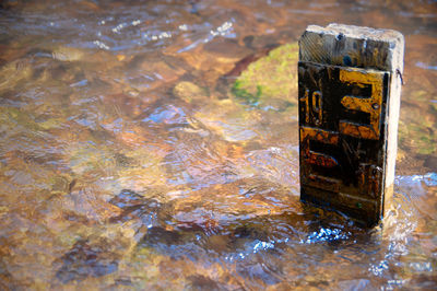 High angle view of rusty metal with reflection