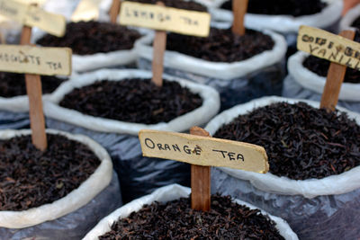Full frame shot of tea variations with labels at market stall