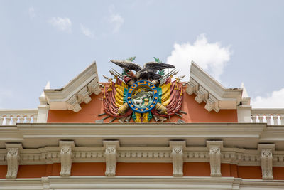 Low angle view of statue against sky