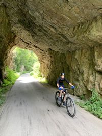Man riding bicycle on road