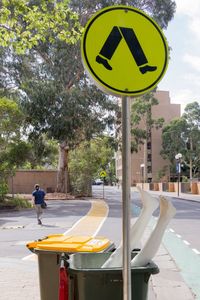View of road sign against trees