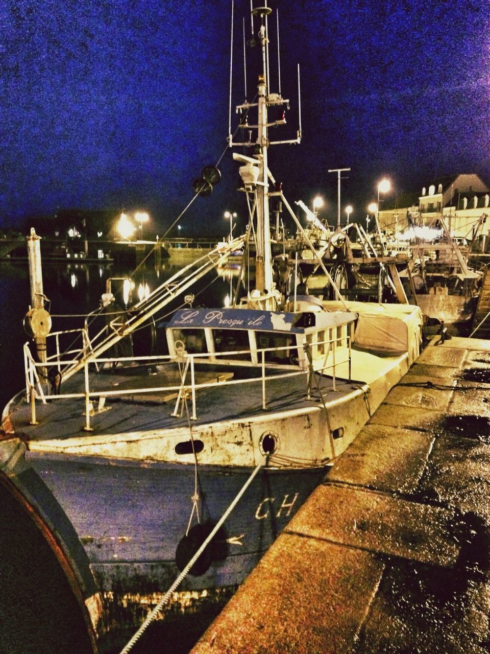 night, illuminated, nautical vessel, transportation, harbor, moored, mode of transport, industry, commercial dock, boat, built structure, blue, architecture, water, river, development, building exterior, freight transportation, crane - construction machinery, outdoors