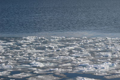 High angle view of sea shore against sky