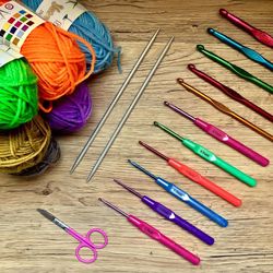 High angle view of colorful knitting equipment on table