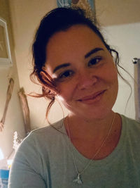 Portrait of smiling woman at home